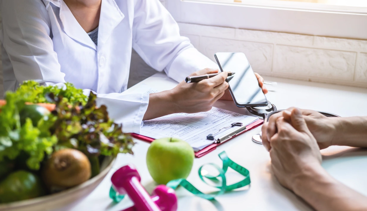 Doctor with healthy food items